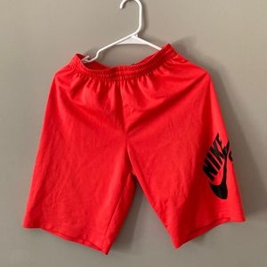 Short vibrant orange, bought too small, did not wear it